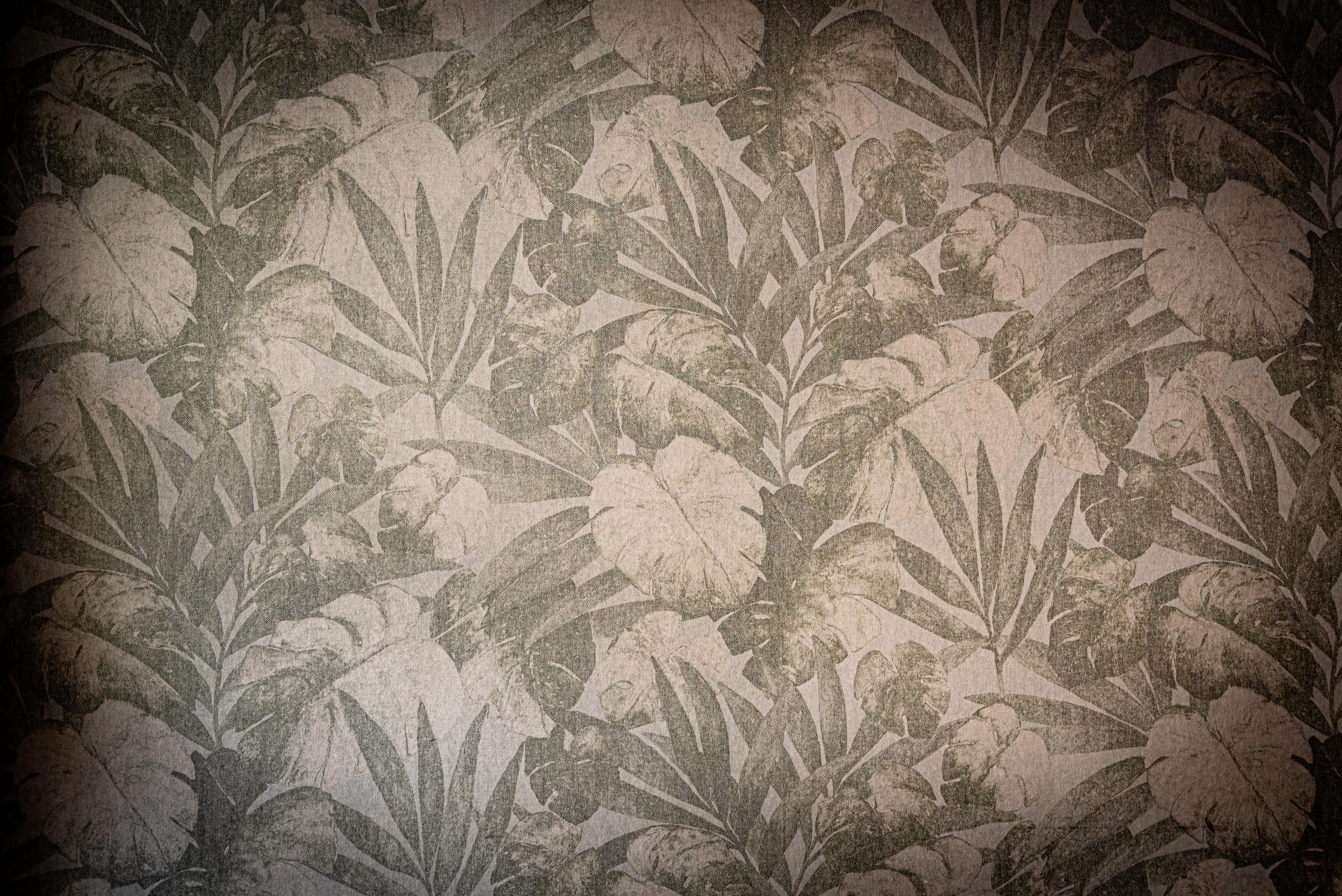 Vintage Palm wallpaper with weathered tropical leaves in taupe