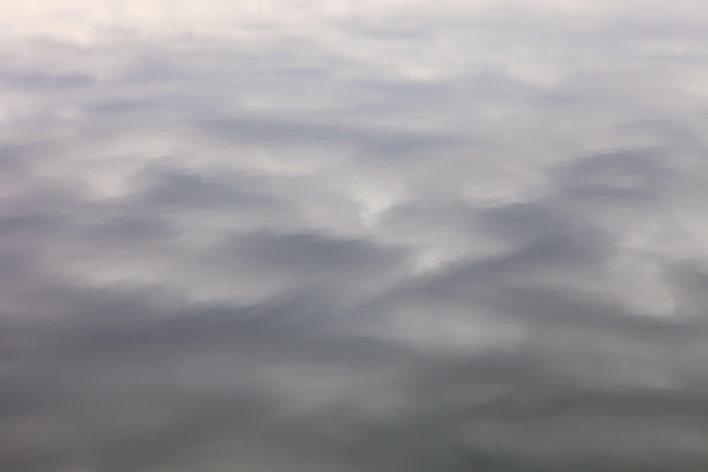 Misty Horizon, wallpaper mural, soft cloudlike brushstrokes flow across a muted background, creating a tranquil atmosphere