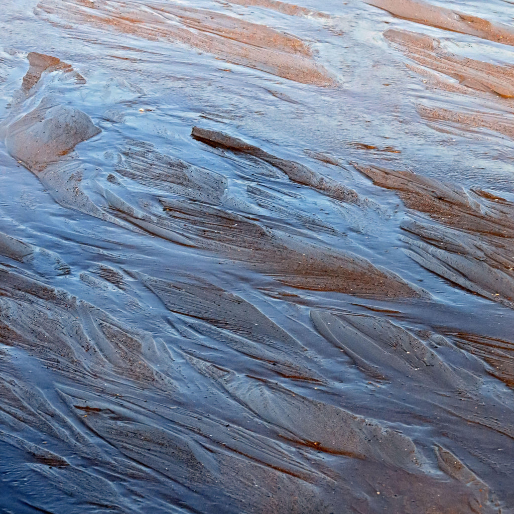 Tidal Stone, peel and stick wallpaper, layered textures inspired by wet shoreline sand create a natural, flowing surface