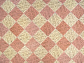 Harlequin Tile wallpaper in dusky pink and cream diamonds