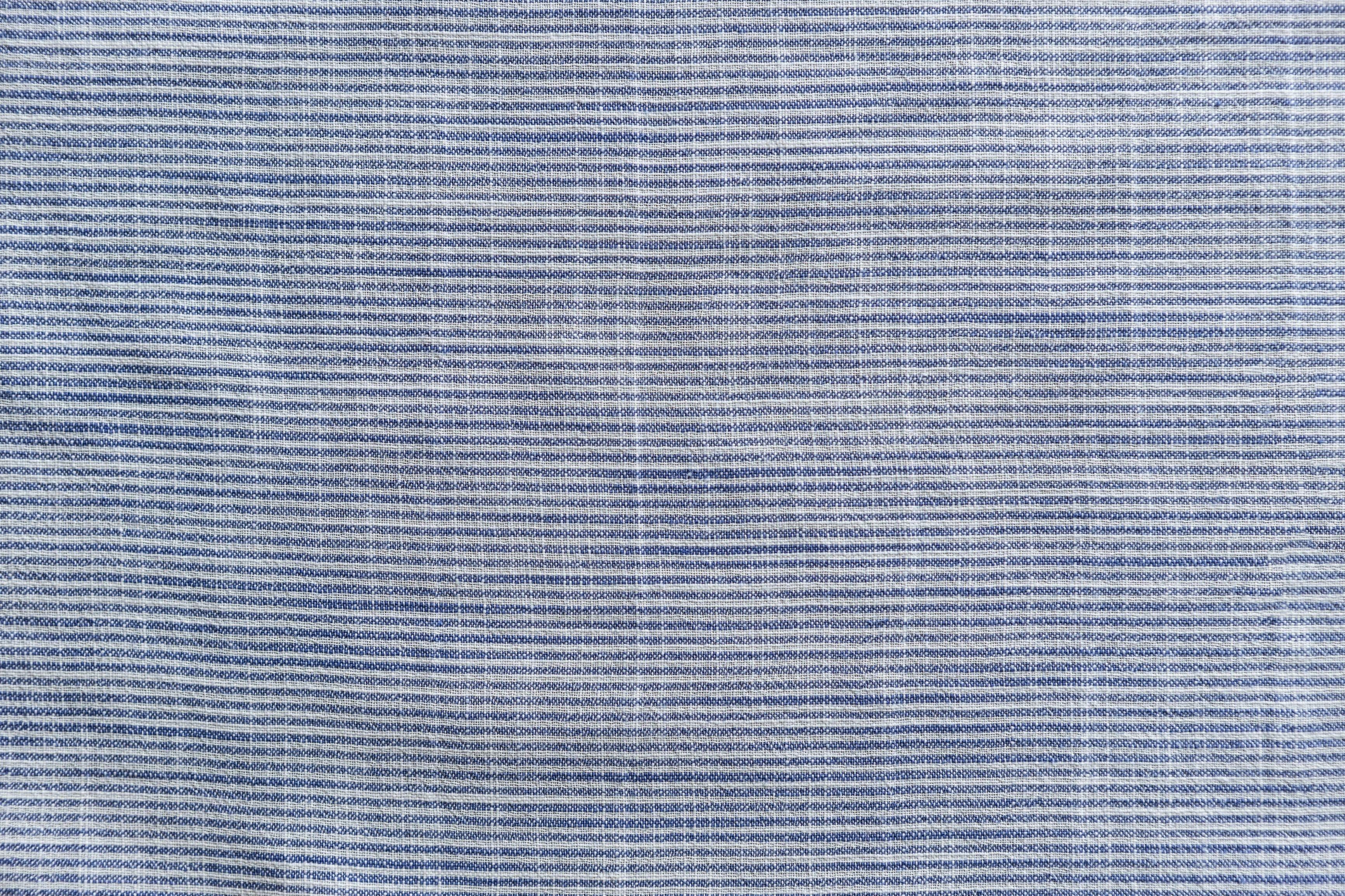 Chambray Linen wallpaper in soft blue and white weave