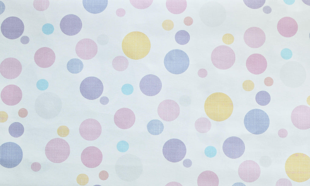Bubble Pop wallpaper with soft pastel dots on a white ground