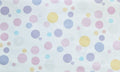 Bubble Pop wallpaper with soft pastel dots on a white ground