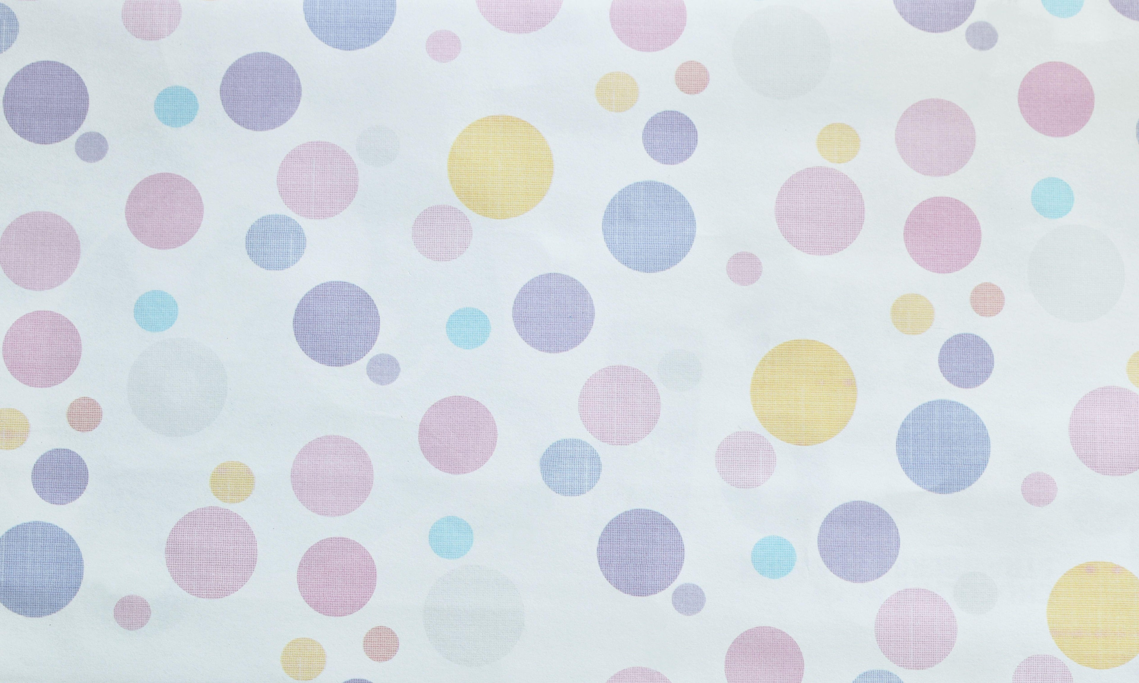 Bubble Pop wallpaper with soft pastel dots on a white ground