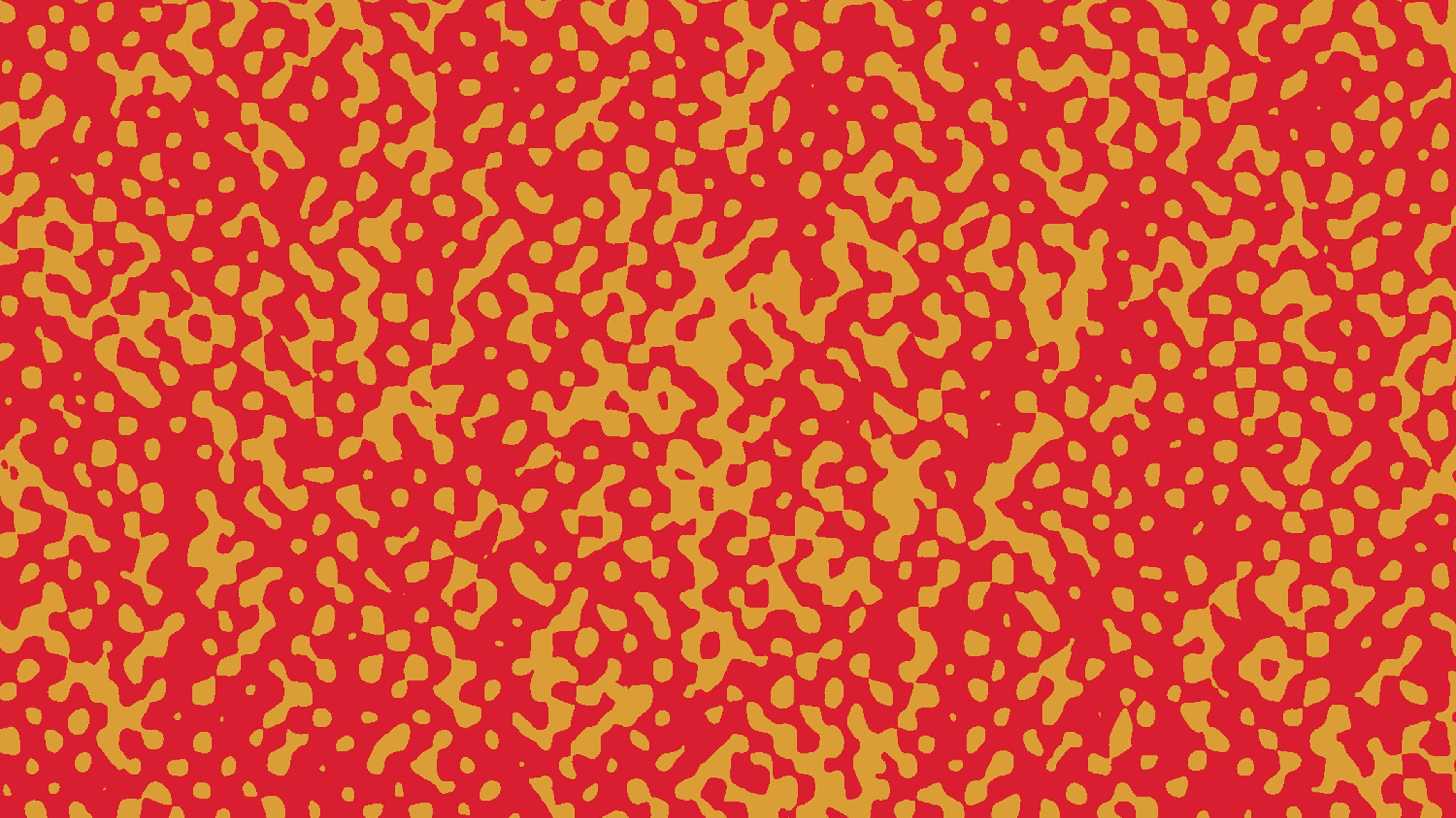 Confetti Speckle wallpaper with yellow dots on red