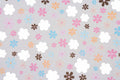 Retro Bloom wallpaper with hand-drawn daisies in pink, orange and blue on a grey ground