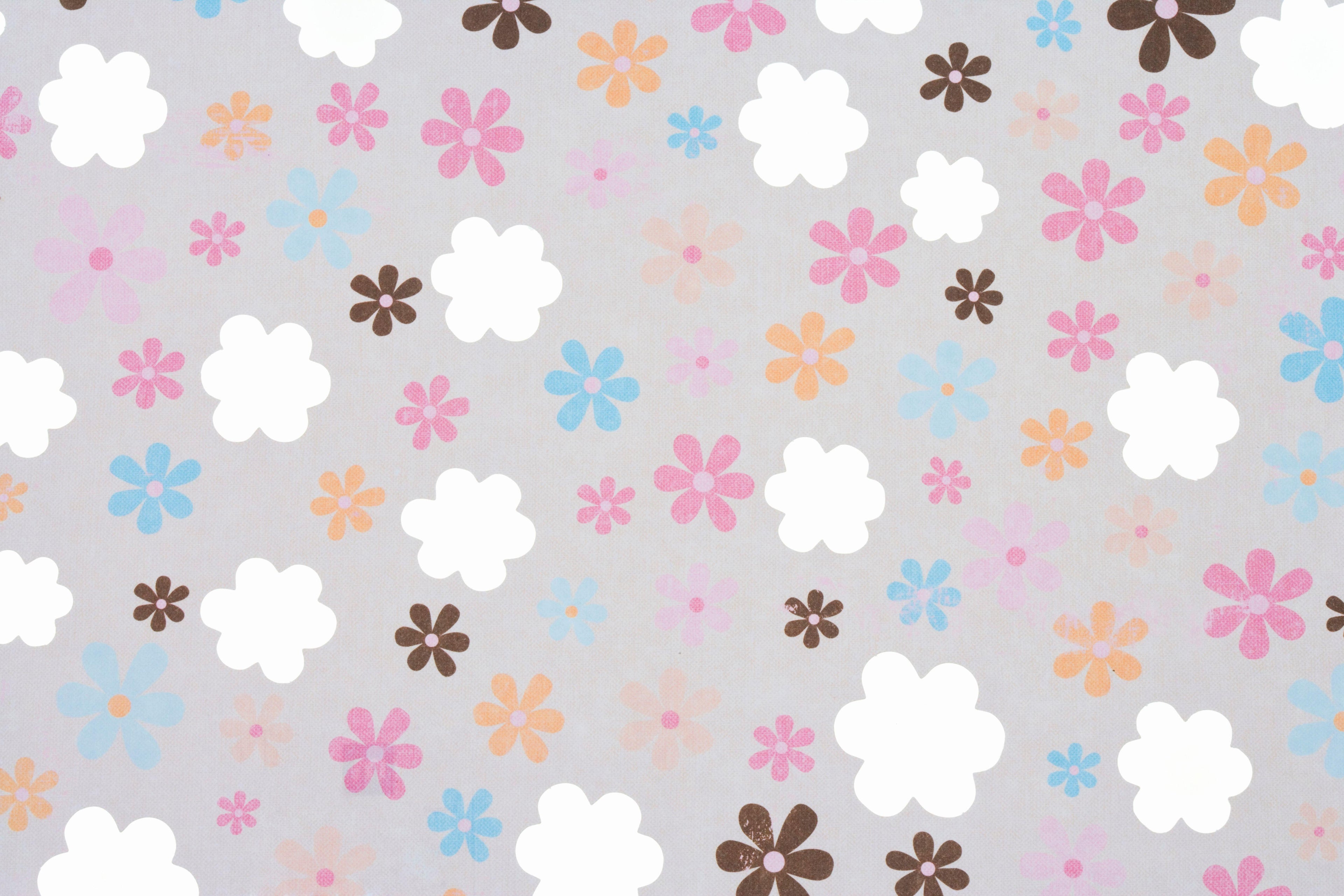 Retro Bloom wallpaper with hand-drawn daisies in pink, orange and blue on a grey ground