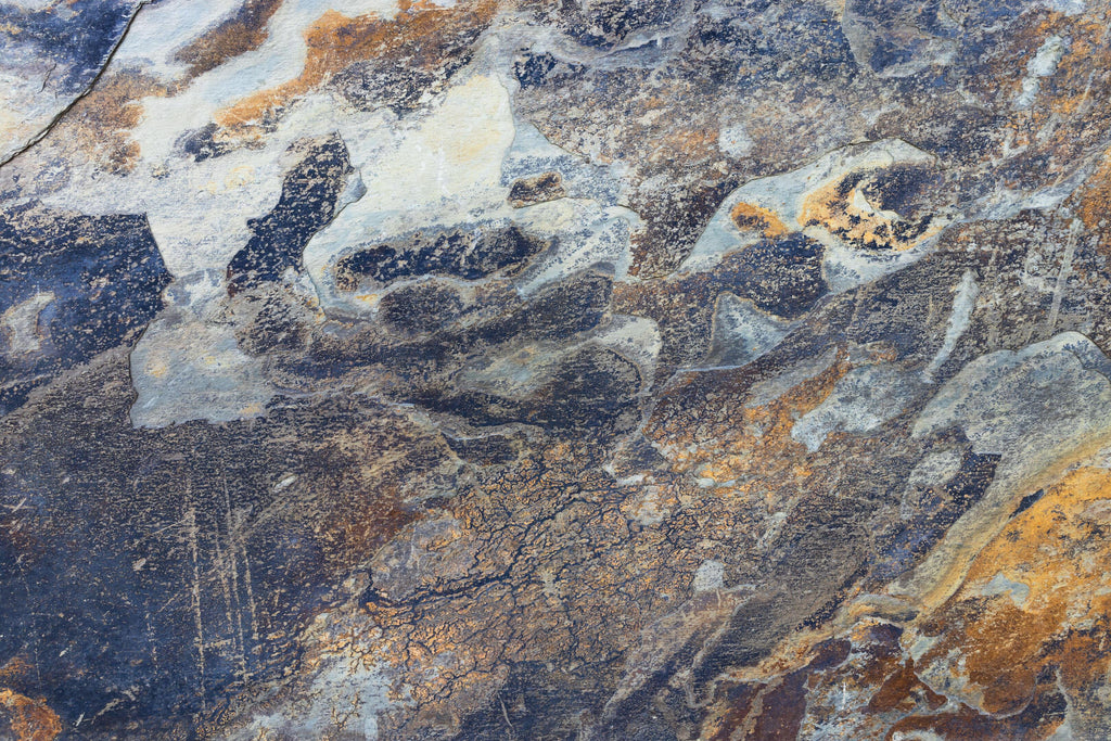 Oxide Stone, peel and stick wallpaper, rich mineral textures blend deep blues, slate tones, and warm rust accents