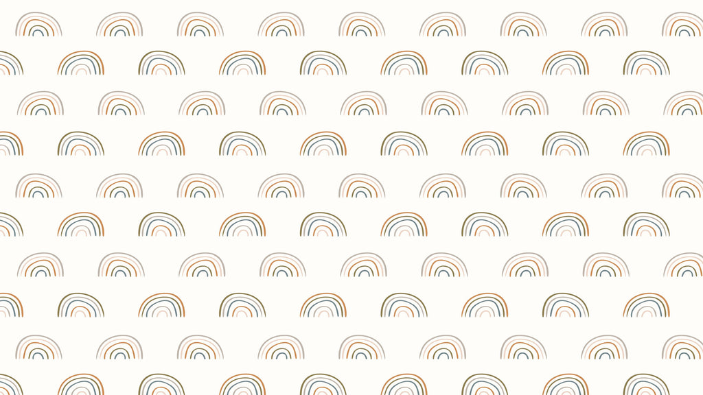 Rainbow Arc, peel and stick wallpaper, scatters cheerful little rainbow arches across a soft cream
