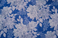 Cobalt Bloom wallpaper with pale blooms on cobalt blue
