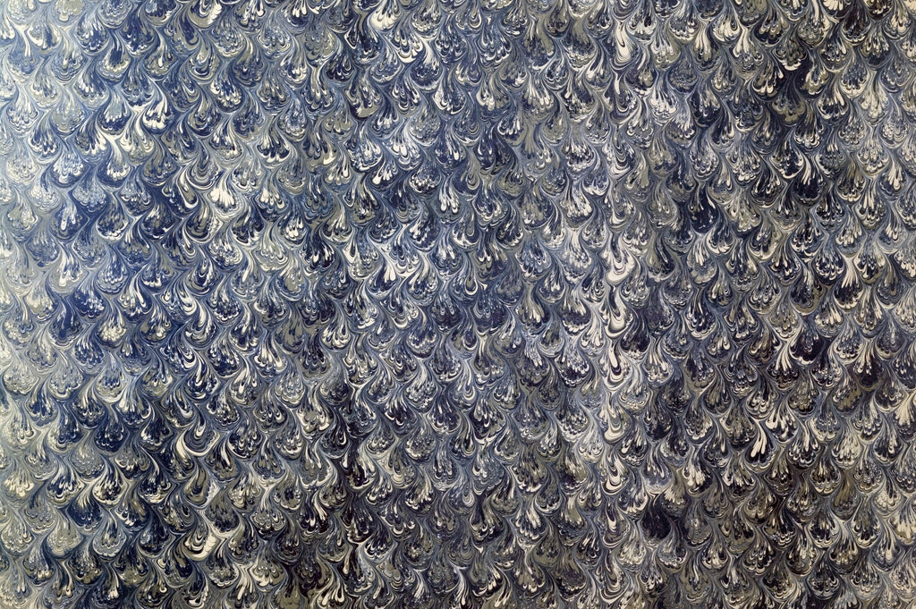 Indigo Plume, peel and stick wallpaper, intricate feather-like marbling patterns flow across deep blue and ivory tones