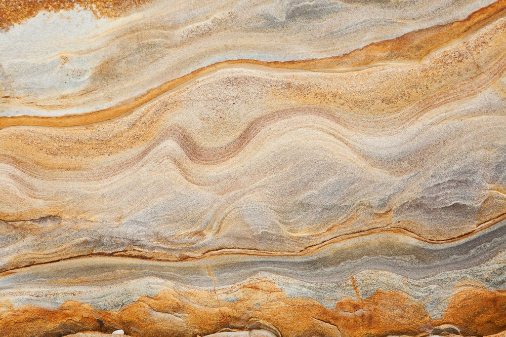 Mineral Drift, peel and stick wallpaper, softly layered mineral bands ripple across the surface, inspired by natural
