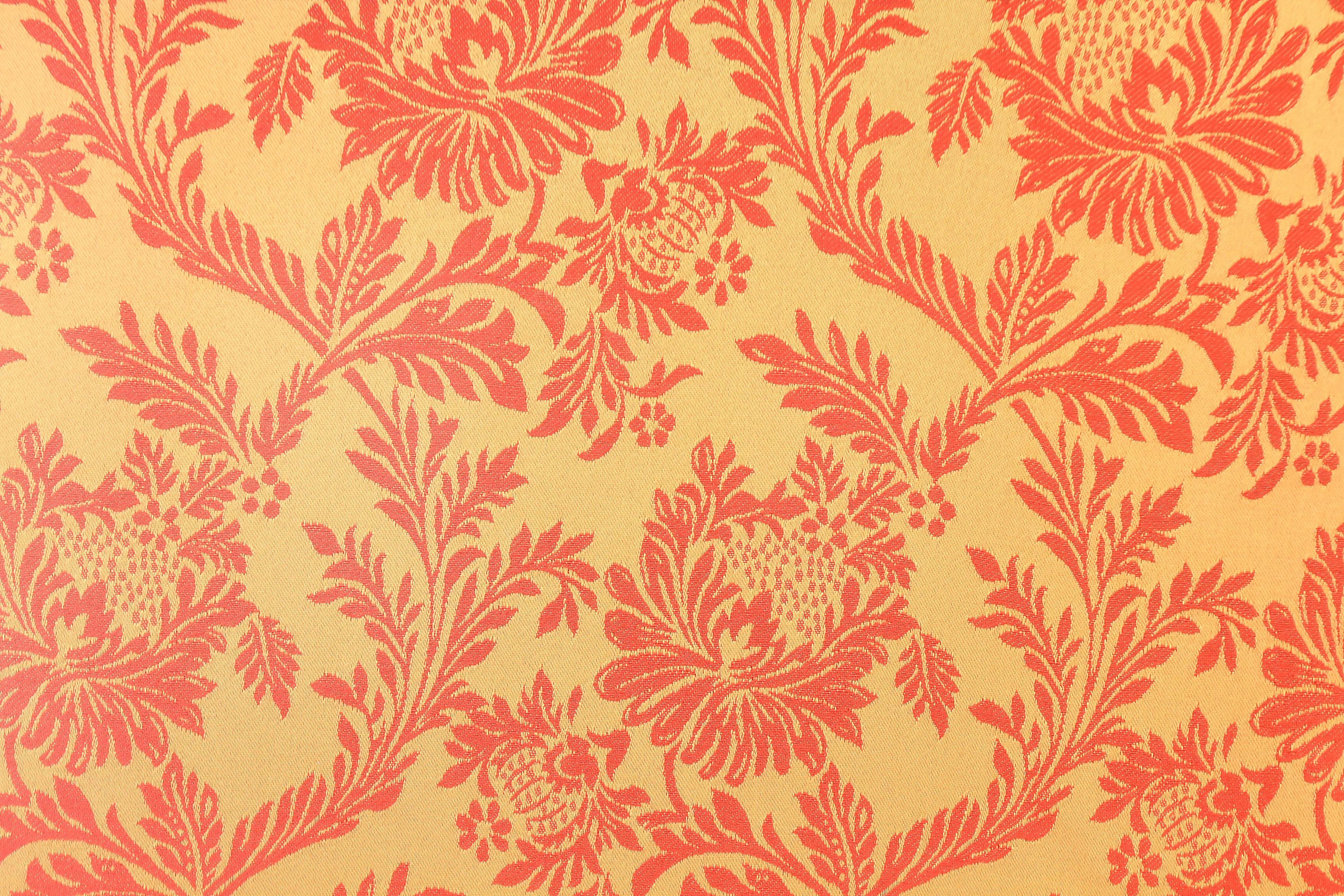 Amber Damask wallpaper in coral and orange on peach