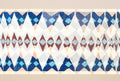 Indigo Harlequin wallpaper with indigo diamonds