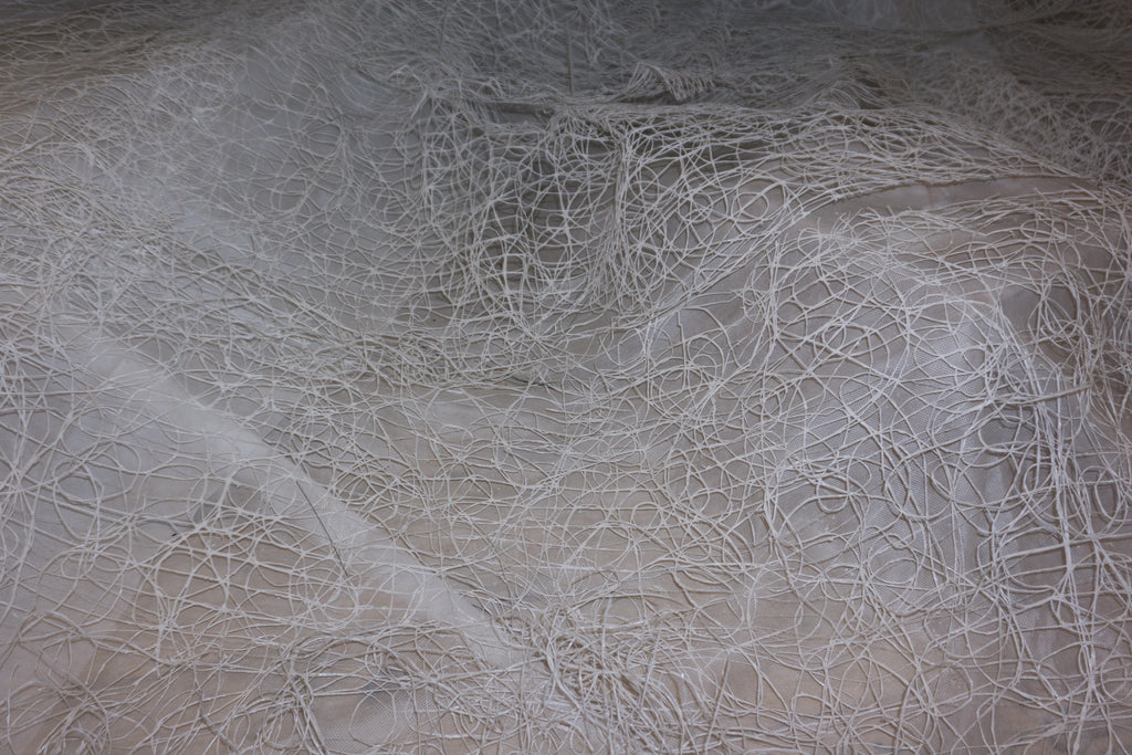 Silk Threads, peel and stick wallpaper, delicate white thread-like patterns form an intricate textured surface over