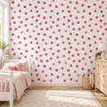 Rosy Dots peel and stick wallpaper styled on a feature wall