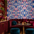 Coral Kaleidoscope peel and stick wallpaper styled on a feature wall